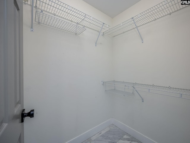 67 Ole Still Ln, Elgin, SC 29045 - walk in closet with light marble finish flooring