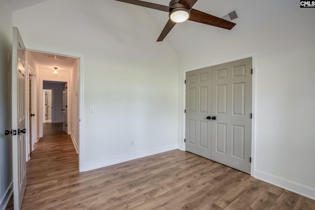 67 Ole Still Ln, Elgin, SC 29045 - unfurnished bedroom with attic access, light wood finished floors, a closet, and baseboards