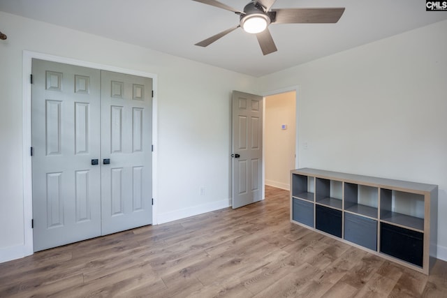 67 Ole Still Ln, Elgin, SC 29045 - unfurnished bedroom featuring wood finished floors, baseboards, a closet, and a ceiling fan