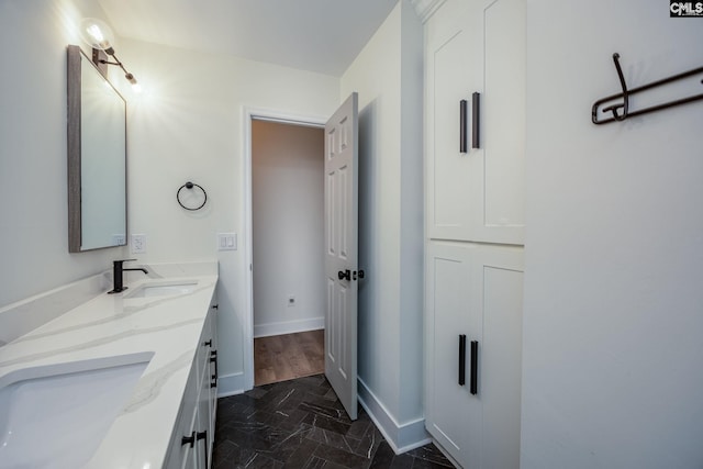 67 Ole Still Ln, Elgin, SC 29045 - bathroom with double vanity and baseboards