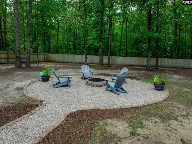 67 Ole Still Ln, Elgin, SC 29045 - fenced backyard featuring a fire pit and a patio area