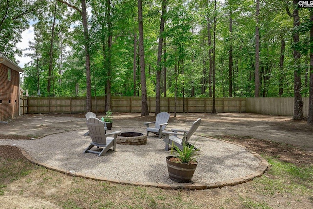 67 Ole Still Ln, Elgin, SC 29045 - fenced backyard with a fire pit and a patio
