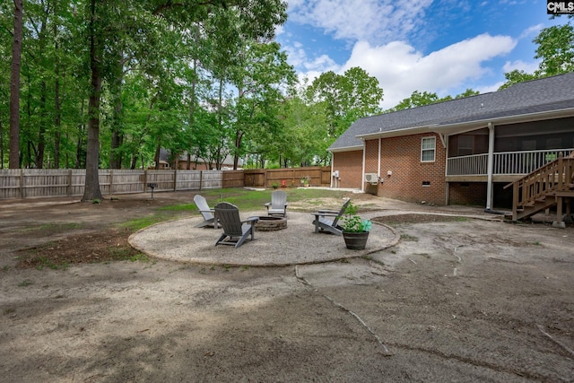 67 Ole Still Ln, Elgin, SC 29045 - view of patio with a fire pit, a sunroom, and stairs