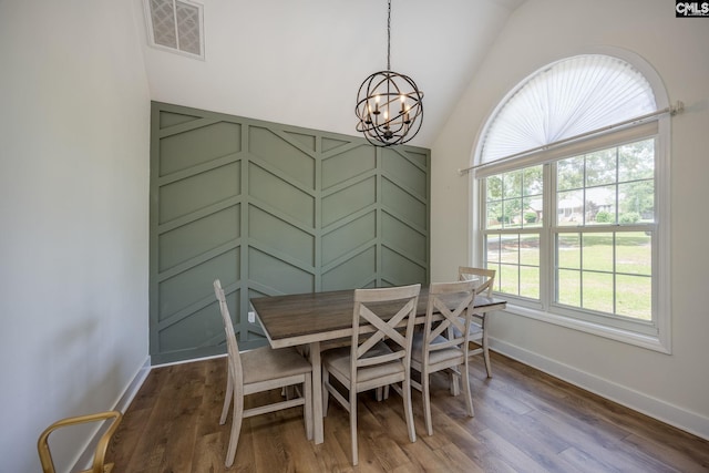 67 Ole Still Ln, Elgin, SC 29045 - dining space featuring a chandelier, lofted ceiling, wood finished floors, and baseboards