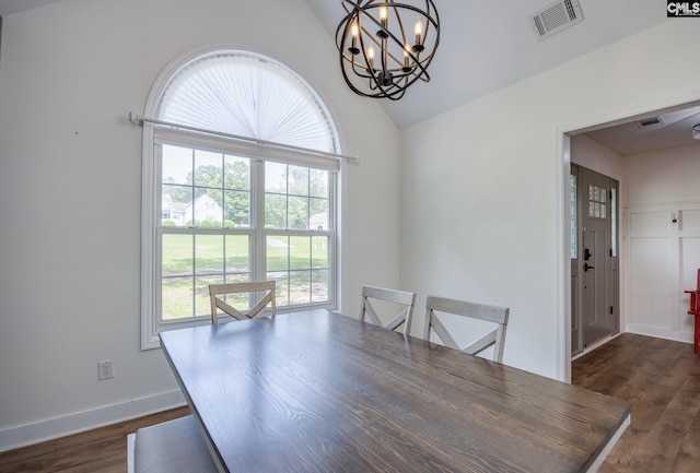 67 Ole Still Ln, Elgin, SC 29045 - dining space featuring lofted ceiling, a chandelier, dark wood finished floors, and baseboards