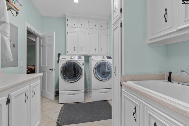 6148 Marthas Glen Rd, Columbia, SC 29209 - laundry room featuring cabinet space, washer and dryer, light tile patterned floors, and electric panel