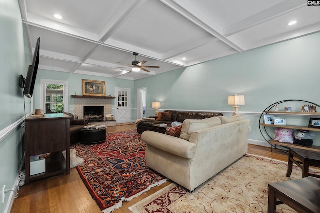6148 Marthas Glen Rd, Columbia, SC 29209 - living room with coffered ceiling, ceiling fan, a fireplace with raised hearth, wood finished floors, and beam ceiling