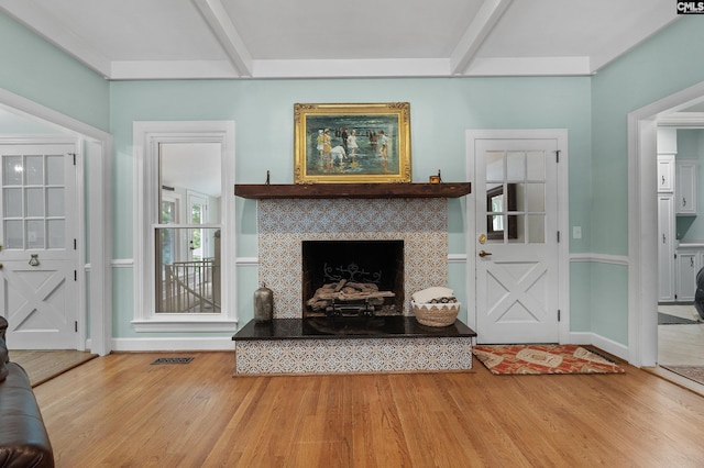 6148 Marthas Glen Rd, Columbia, SC 29209 - living area with wood finished floors, a tiled fireplace, and baseboards