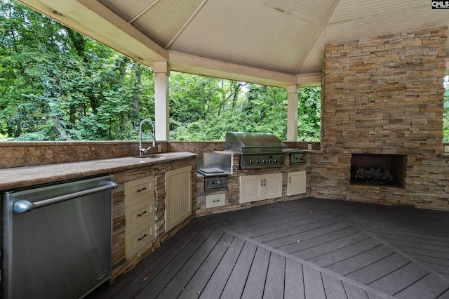 6148 Marthas Glen Rd, Columbia, SC 29209 - deck with a sink and an outdoor stone fireplace