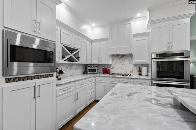 6148 Marthas Glen Rd, Columbia, SC 29209 - kitchen with appliances with stainless steel finishes, white cabinets, crown molding, recessed lighting, and backsplash