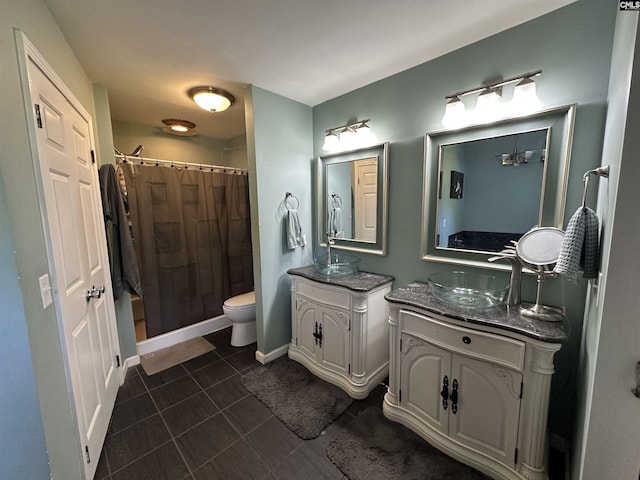 109 Cranewater Dr, Columbia, SC 29212 - full bathroom with two vanities, a shower with curtain, tile patterned floors, toilet, and baseboards