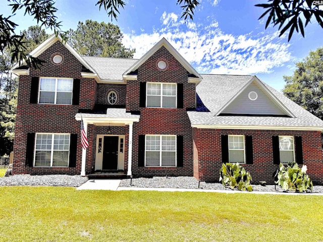 2 Alverston Ct, Irmo, SC 29063 - georgian-style home with roof with shingles, a front lawn, and brick siding