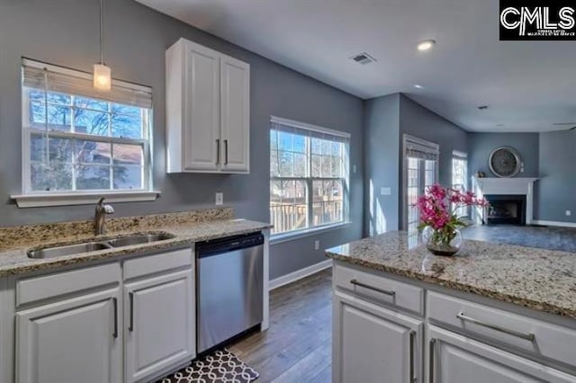 2 Alverston Ct, Irmo, SC 29063 - kitchen featuring dishwasher, a sink, white cabinets, light wood finished floors, and baseboards
