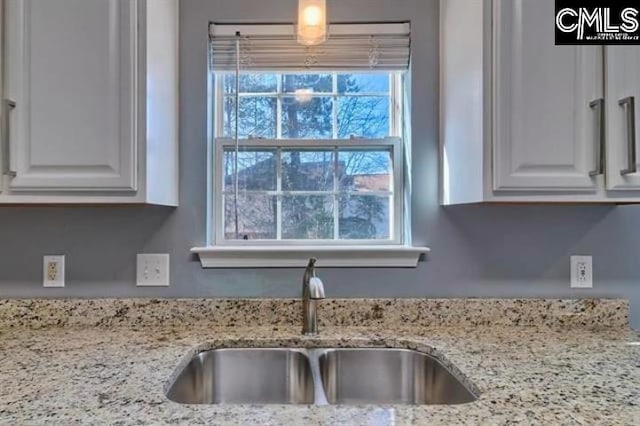 2 Alverston Ct, Irmo, SC 29063 - kitchen with a sink, white cabinets, and light stone counters