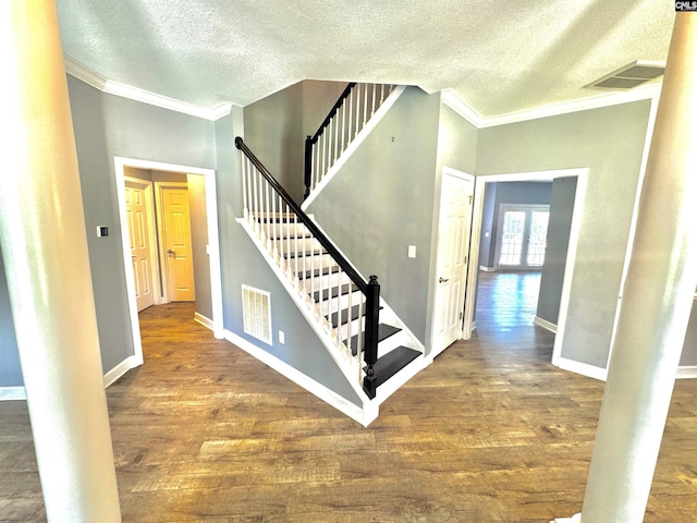 2 Alverston Ct, Irmo, SC 29063 - stairway featuring a textured ceiling, ornamental molding, wood finished floors, and baseboards