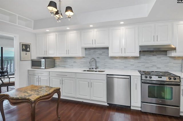1829 Senate St Unit 11-A, Columbia, SC 29201 - kitchen featuring appliances with stainless steel finishes, a sink, under cabinet range hood, light countertops, and white cabinets