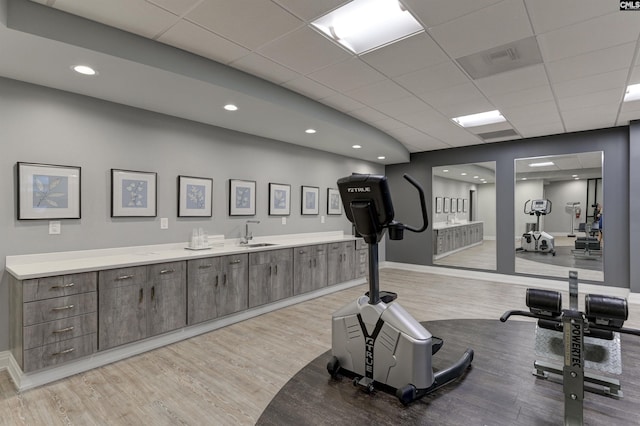 1829 Senate St Unit 11-A, Columbia, SC 29201 - workout room featuring a drop ceiling, light wood-type flooring, a sink, and baseboards