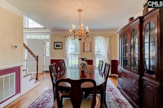 115 Chestnut Woods Ln, Columbia, SC 29212 - dining room featuring a chandelier, plenty of natural light, light wood finished floors, and crown molding