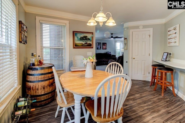 115 Chestnut Woods Ln, Columbia, SC 29212 - dining space featuring dark wood-style floors, ceiling fan, a chandelier, and crown molding