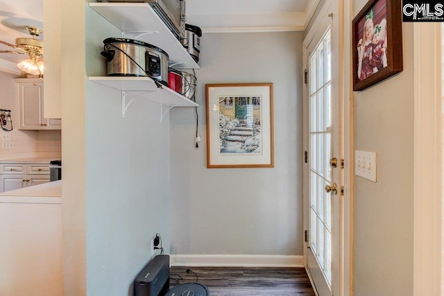 115 Chestnut Woods Ln, Columbia, SC 29212 - laundry area with dark wood-style flooring, ornamental molding, ceiling fan, and baseboards