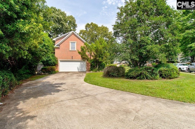 115 Chestnut Woods Ln, Columbia, SC 29212 - view of side of property with an attached garage, driveway, and a lawn