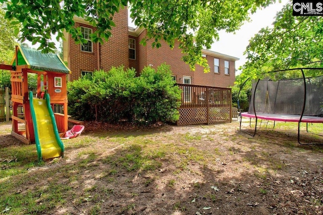 115 Chestnut Woods Ln, Columbia, SC 29212 - view of yard with a trampoline, a playground, and a deck