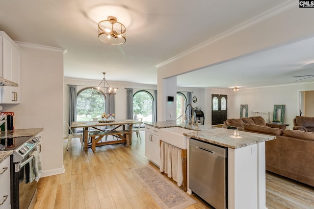 216 Jacobs Mill Pond Rd, Elgin, SC 29045 - kitchen with stainless steel appliances, a sink, a chandelier, ornamental molding, and open floor plan