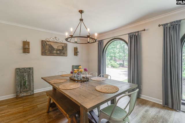 216 Jacobs Mill Pond Rd, Elgin, SC 29045 - dining area with a chandelier, crown molding, wood finished floors, and baseboards