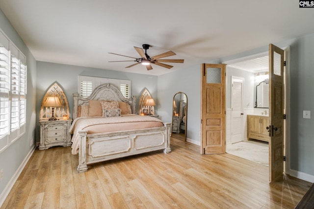 216 Jacobs Mill Pond Rd, Elgin, SC 29045 - bedroom featuring light wood-type flooring, baseboards, ensuite bath, and a ceiling fan