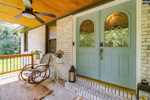 216 Jacobs Mill Pond Rd, Elgin, SC 29045 - property entrance featuring covered porch, brick siding, and a ceiling fan