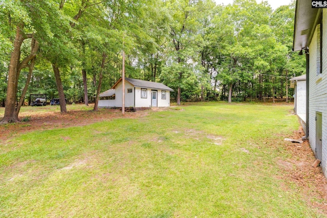 216 Jacobs Mill Pond Rd, Elgin, SC 29045 - view of grassy yard with an outbuilding and view of scattered trees