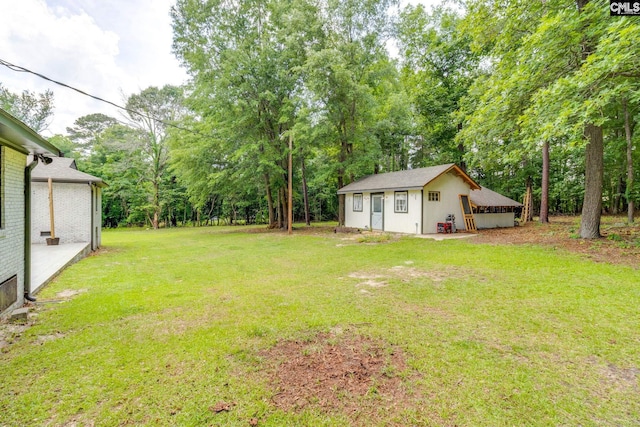 216 Jacobs Mill Pond Rd, Elgin, SC 29045 - view of green lawn with view of wooded area