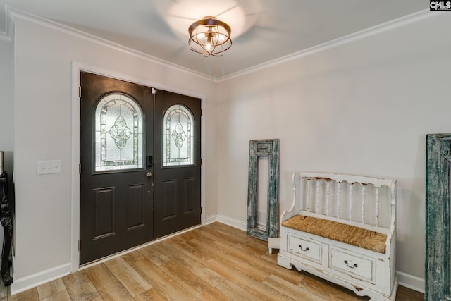 216 Jacobs Mill Pond Rd, Elgin, SC 29045 - entryway featuring crown molding, light wood finished floors, and baseboards