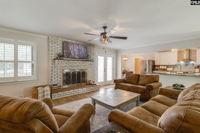 216 Jacobs Mill Pond Rd, Elgin, SC 29045 - living room with wood finished floors, ceiling fan, ornamental molding, and a fireplace