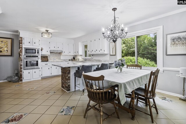 111 Rusty Barn Rd, Columbia, SC 29212 - dining space featuring light tile patterned floors, ornamental molding, a chandelier, and baseboards