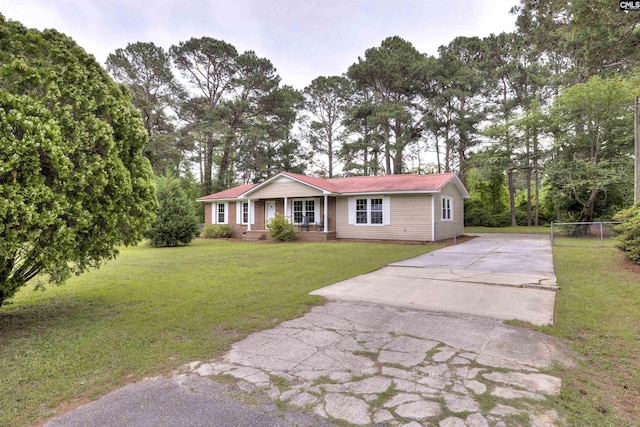 137 Wingate St, Darlington, SC 29532 - single story home featuring concrete driveway, a front yard, metal roof, and covered porch