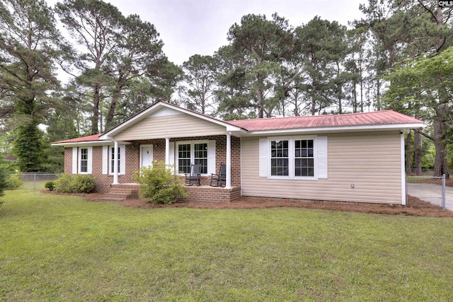 137 Wingate St, Darlington, SC 29532 - ranch-style house with a porch, metal roof, and brick siding