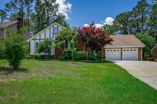 800 Wotan Rd, Columbia, SC 29229 - view of front facade with a garage, brick siding, driveway, and a front lawn