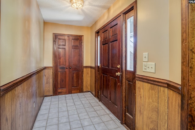 800 Wotan Rd, Columbia, SC 29229 - entrance foyer featuring a wainscoted wall, wooden walls, a textured ceiling, healthy amount of natural light, and light tile patterned floors