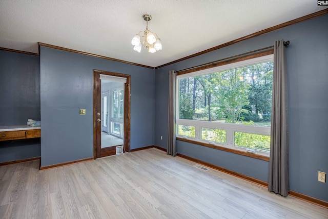 800 Wotan Rd, Columbia, SC 29229 - spare room featuring a chandelier, crown molding, light wood-style floors, and baseboards