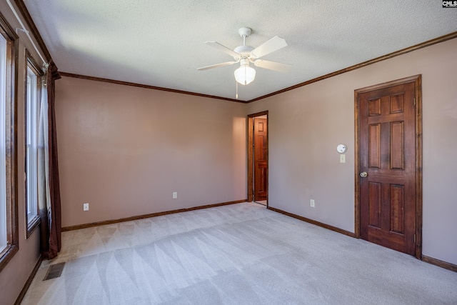 800 Wotan Rd, Columbia, SC 29229 - empty room with light colored carpet, ceiling fan, ornamental molding, baseboards, and a textured ceiling