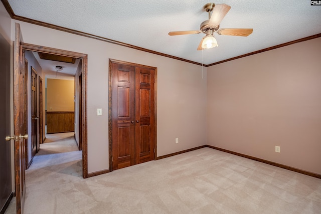 800 Wotan Rd, Columbia, SC 29229 - spare room with attic access, light carpet, a ceiling fan, a textured ceiling, and crown molding