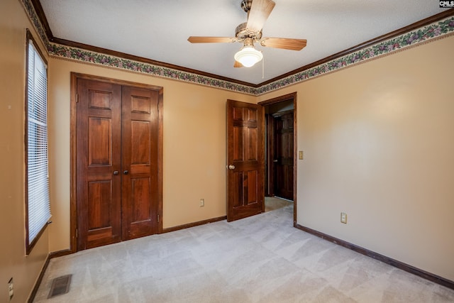 800 Wotan Rd, Columbia, SC 29229 - unfurnished bedroom with a closet, baseboards, light carpet, crown molding, and ceiling fan