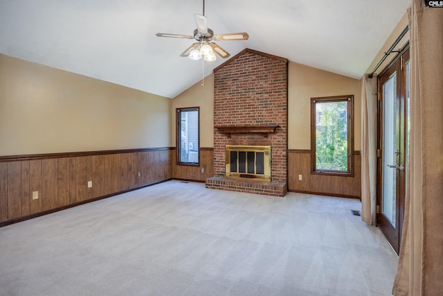 800 Wotan Rd, Columbia, SC 29229 - unfurnished living room with a wainscoted wall, lofted ceiling, wooden walls, ceiling fan, and carpet