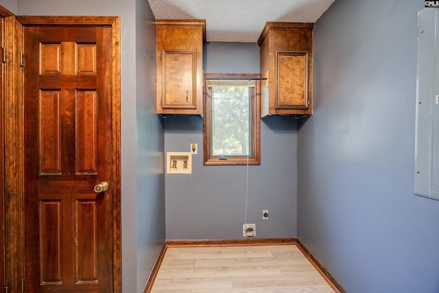 800 Wotan Rd, Columbia, SC 29229 - laundry room featuring electric dryer hookup, hookup for a washing machine, cabinet space, light wood-style flooring, and baseboards