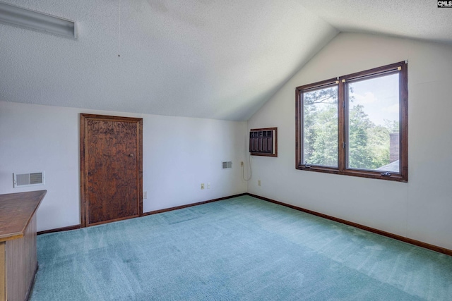800 Wotan Rd, Columbia, SC 29229 - additional living space featuring a textured ceiling, vaulted ceiling, carpet floors, baseboards, and an AC wall unit