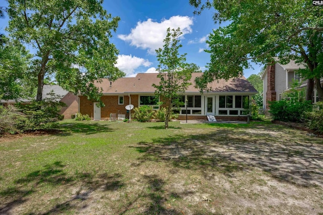 800 Wotan Rd, Columbia, SC 29229 - rear view of house featuring a lawn and a sunroom