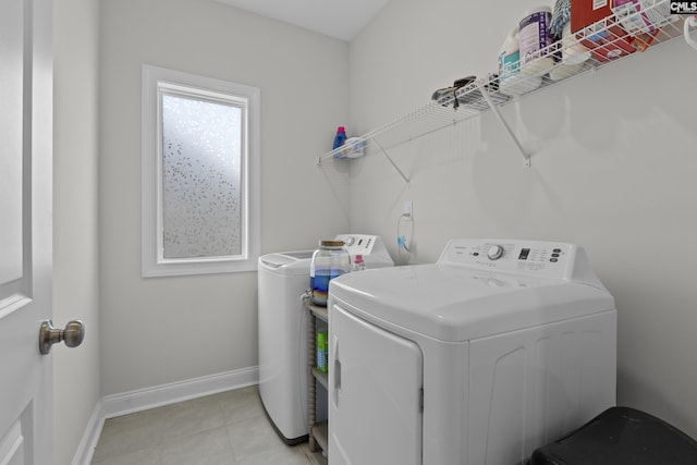 309 Springbrook Way, Chapin, SC 29036 - washroom with washing machine and clothes dryer, baseboards, and light tile patterned flooring