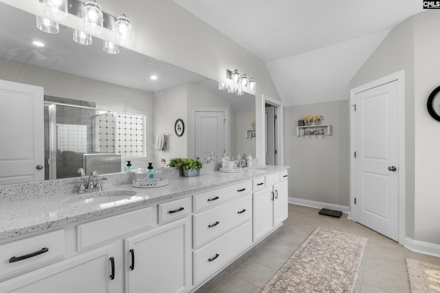 309 Springbrook Way, Chapin, SC 29036 - full bathroom featuring double vanity, a stall shower, tile patterned flooring, baseboards, and vaulted ceiling