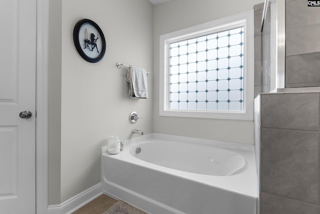 309 Springbrook Way, Chapin, SC 29036 - full bathroom featuring a bath, tile patterned flooring, and baseboards